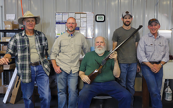 The crew at Wyoming Armory. Left to right: Evan Bennett (wood working), Cameron Davis (general gunsmithing/shipping), Keith Kilby (lead gunsmith), Todd Tucker (casehardening/bluing) and Mark Douglas (owner/gunsmith).